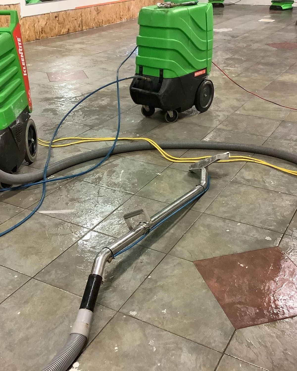 Commercial drying equipment operating across a large tile floor