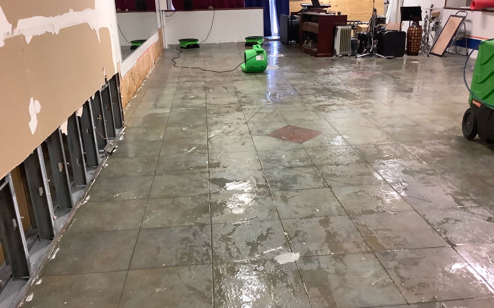 Restoration equipment operating inside a commercial room