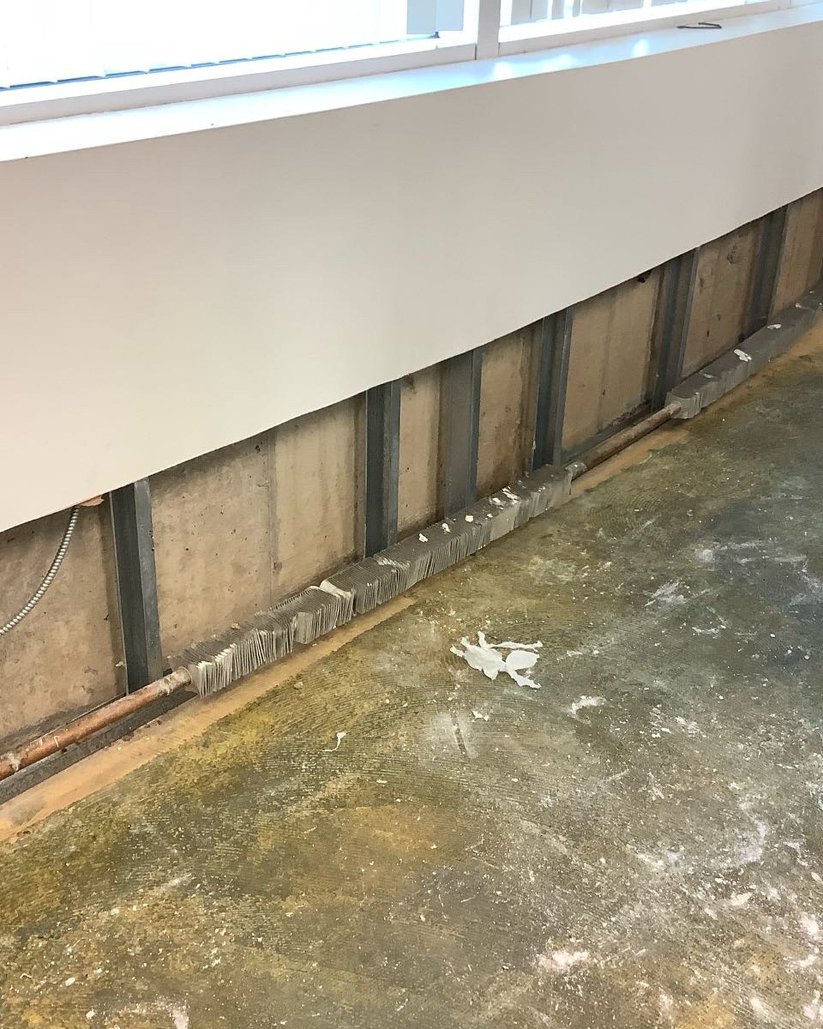 Lower drywall removed after a commercial water loss